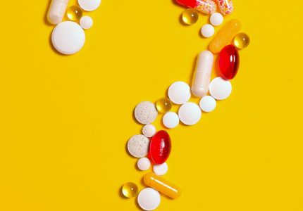 medication pills isolated on yellow background