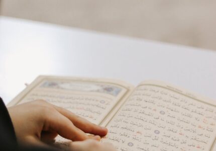 hands over koran
