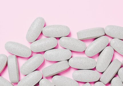 tablets on pink surface