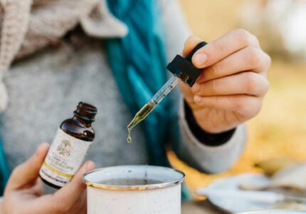photo of person holding bottle